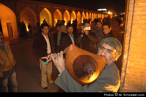 Alireza Najafi, 40, playing his self-made <i />nay-anbaan</i> on the Si-o-se pol bridge, Isfahan, Iran.